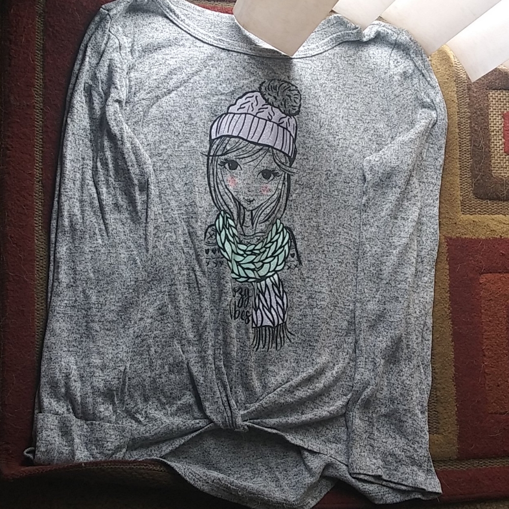 A long sleeve shirt that's Gray has purple and blu